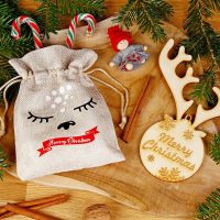 Sacchetto di iuta 13 x 18 cm - Natale + pallina di legno con corna Idea regalo