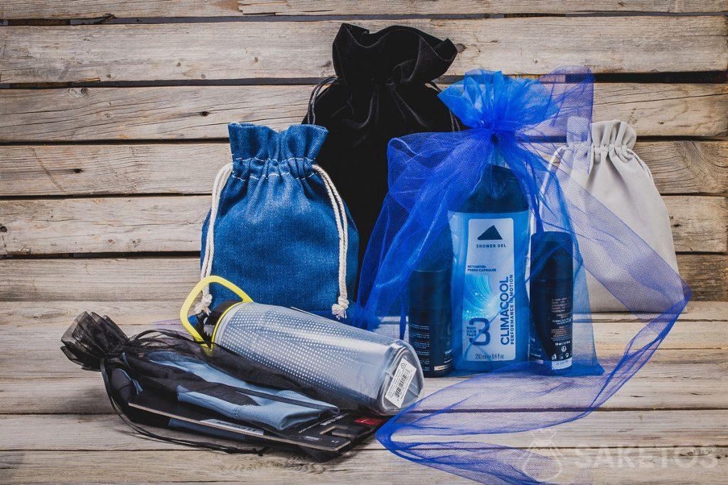 Cosmetici, gadget sportivi - regali per uomo in eleganti borse in tessuto